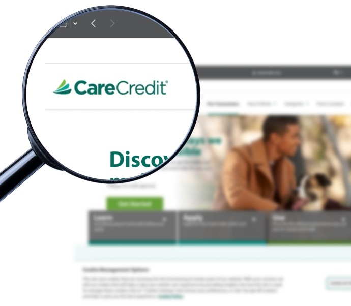 Magnifying glass showing Care Credit logo on their website