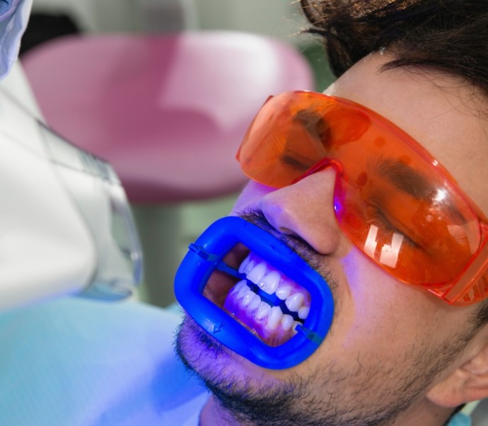 Man receiving professional teeth whitening from Braintree cosmetic dentist