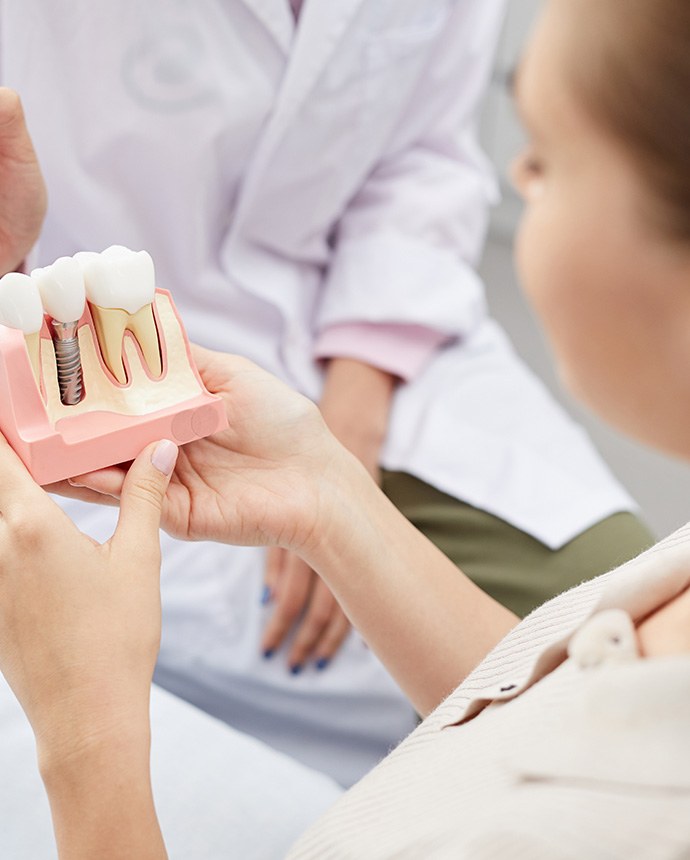 Patient consulting with dentist about implants
